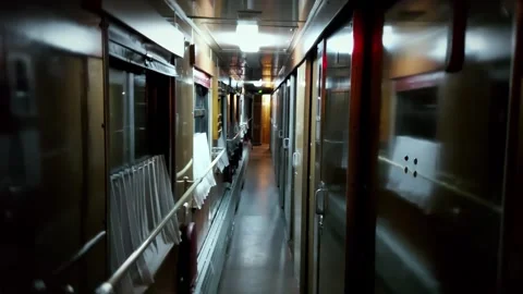 Interior view old private-compartment sleeper car carriage train corridor night. Stock Footage 341658146