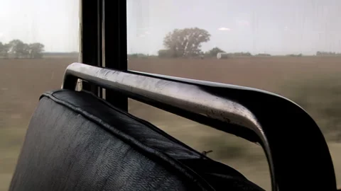 Interior View of an Old Train Moving Past Rural Fields in Argentina - 4K Stock Footage 336684734