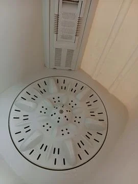 Interior view or inside view of white washing machine showing drum Stock Photos