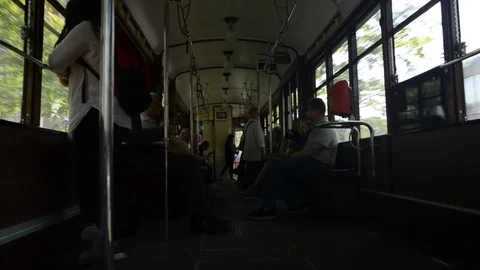 Interior view of passengers inside a moving traditional tram carriage Stock Footage 88902101