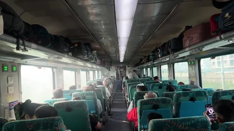 Interior View of Passengers Sitting in a Modern AC Chair Car Train Coach in Stock Footage 336941727