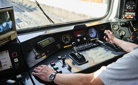 Interior view of the pilot hands and instrument panel cockpit of ancient trai Stock Photos