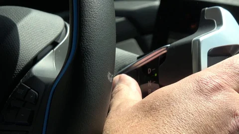 Interior view of pushing the start button of a modern electric vehicle 4k Stock Footage 108615556