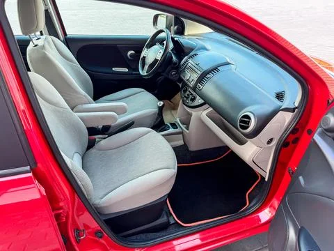 Interior view of a red car highlighting front seats and dashboard showing d.. Stock Photos