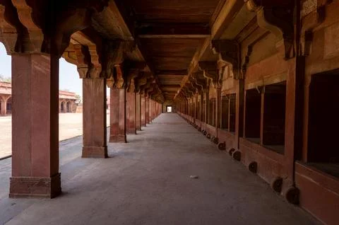 Interior view of red sandstone stable corridor at Jodha Bai Palace, Fatehpur 写真素材
