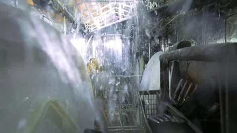 Interior View of Running Dishwasher with Water Jets and Clean Plates 库存影片 334309922