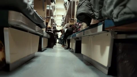 Interior view of Russian platzkart train car during night journey. Open-plan Stock Footage 341658150