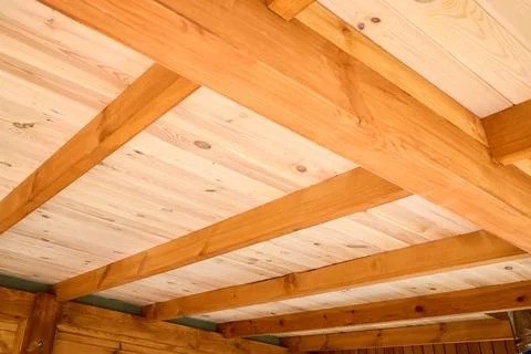 Interior view showcases rustic wooden ceiling crafted from natural Douglas .. 库存照片