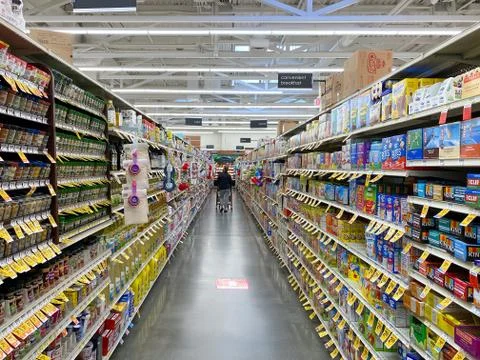 Interior view of a supermarket with aisle with shelves full of variety of Stock Photos