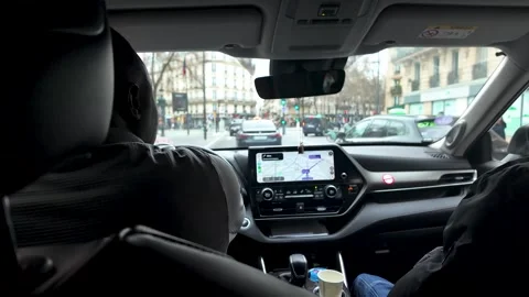 Interior view of a taxi driving through Paris streets with passengers and Stock Footage 330858283