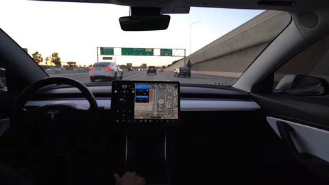 Interior view of Tesla autonomous car or EV in full self driving autopilot mode Stock Footage 118857158