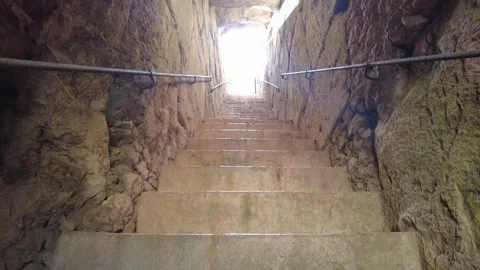 Interior view of an underground tunnel with a staircase made of bricks. Stock Footage 241656991