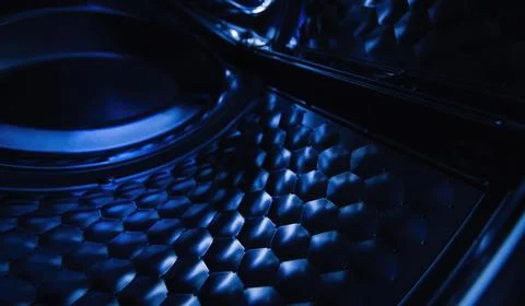 Interior view of the washing machine drum in dark cool colors. Perspective view Foto stock