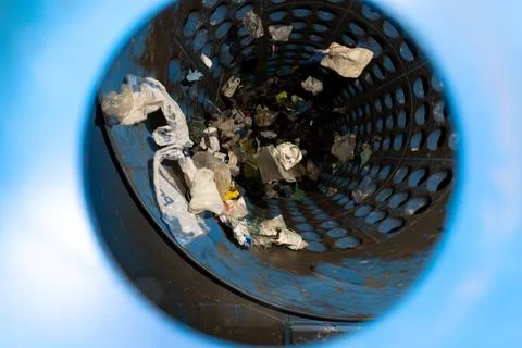 Interior view of waste sorting drum machine with plastic debris inside 库存照片