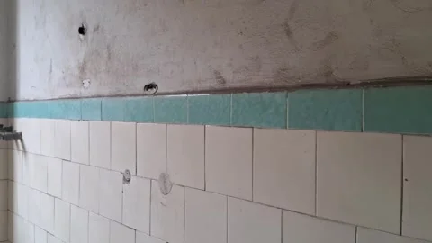 Interior wall movement video showing vintage white and teal tiles Stock Footage 345362172