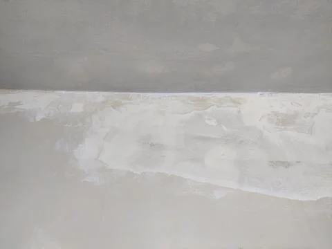 Interior wall under ceiling with water stains peeling paint Stock Photos
