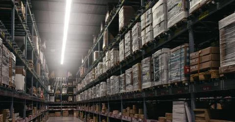 Interior of warehouse. Rows of shelves with boxes Foto stock