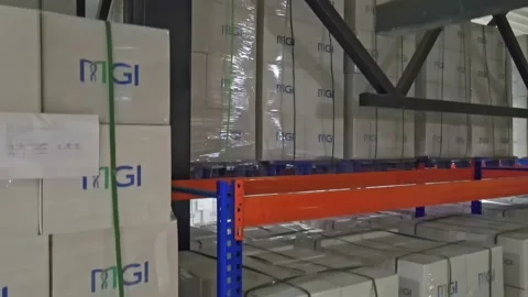 Interior of a warehouse storage with pallets, high shelves, boxes, loaders. Stock Footage 193530401