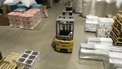 Interior of a warehouse storage with pallets, high shelves, boxes, loaders. Stock Footage 193533567