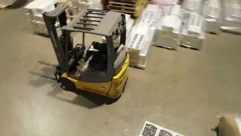 Interior of a warehouse storage with pallets, high shelves, boxes, loaders. Stock Footage 193535098