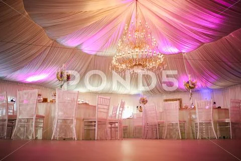 Interior of a wedding tent decoration ready for guests Stock Photos