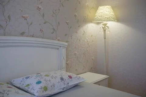 Interior with white bed and table lamp. Bedroom Stock Photos