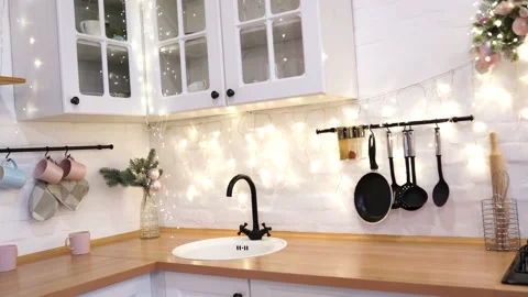 Interior of white kitchen with pink decorated Christmas garlands. Stock-Footage 144119374