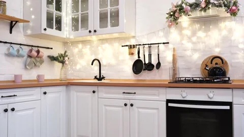 Interior of white kitchen with pink decorated Christmas garlands. Stock Footage 144997708