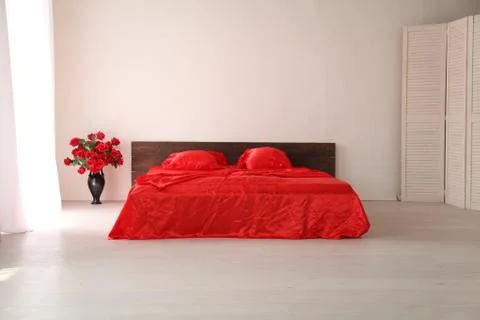 The Interior of the white room with a bed with red Stock Illustration