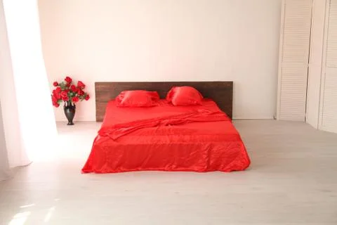 The Interior of the white room with a bed with red Stock Illustration