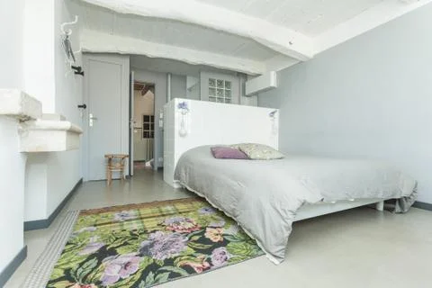 Interior of the white rustic bedroom. Stock Photos