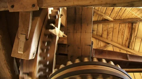 Interior windmill - cogwheels turning + rumble, creaking of the timber Stock Footage 34649691