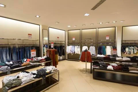 Interior of women's clothes shop Stock Photos