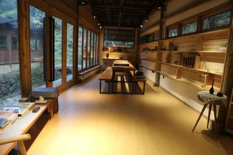 The interior of the wood workshop features an open space with wooden floors.. Stock Photos