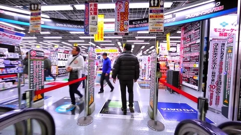 Interior of Yodobashi electronic chain store. Ascending on escalator. Tokyo Stock Footage