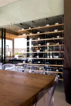 Interiors of a room with wine rack in the background Stock Photos
