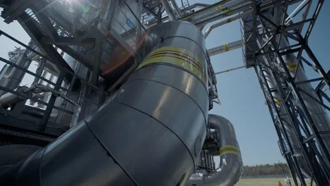 Interlacing pipes and metal structures against the blue sky Stock Footage 139266419