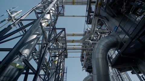 Interlacing pipes and metal structures against the blue sky Stock Footage 139266512