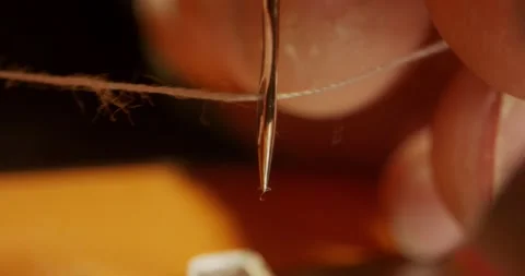 Interlacing the thread through the needle in the sewing machine Stock Footage 150407537