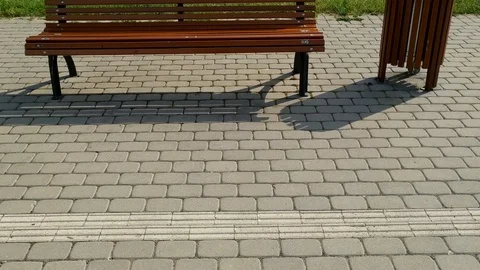Interlock brick infrastructure with a polished bench in Riga, tilt up shot Vídeo Stock 111728063