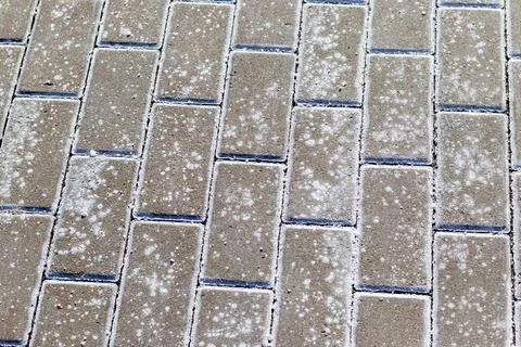 Interlock bricks with frost on them. Texture 스톡 사진