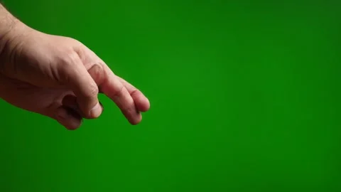 Interlocked fingers on a green background. The process of experiencing and ch Stock Footage 264151403