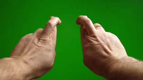 Interlocked fingers on a green background. The process of experiencing and ch Stock Footage 265290955