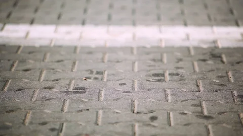 Interlocked road pavement blocks stained with grease and car fuel. Before clean Vídeo Stock 111943522