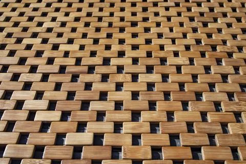 Interlocking Bamboo Wooden Mat Texture with Geometric Grid Pattern and Sunl.. Stock Photos