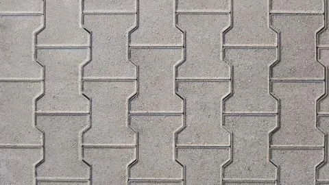 Interlocking block paving background beige grey Stock Photos
