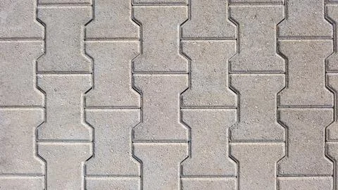 Interlocking block paving floor background beige grey demo example Stock Photos