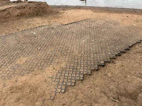 Interlocking Circle Paver Ground Cover Tiles Over Dirt Surface Stock Photos