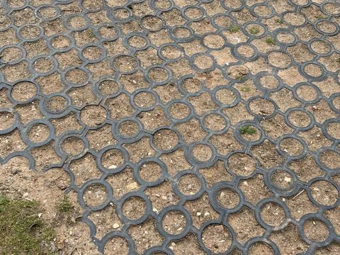 Interlocking Circle Paver Ground Cover Tiles Over Dirt Surface Stock Photos