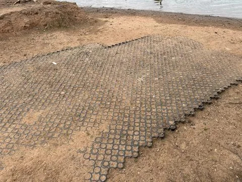 Interlocking Circle Paver Ground Cover Tiles Over Dirt Surface Stock Photos